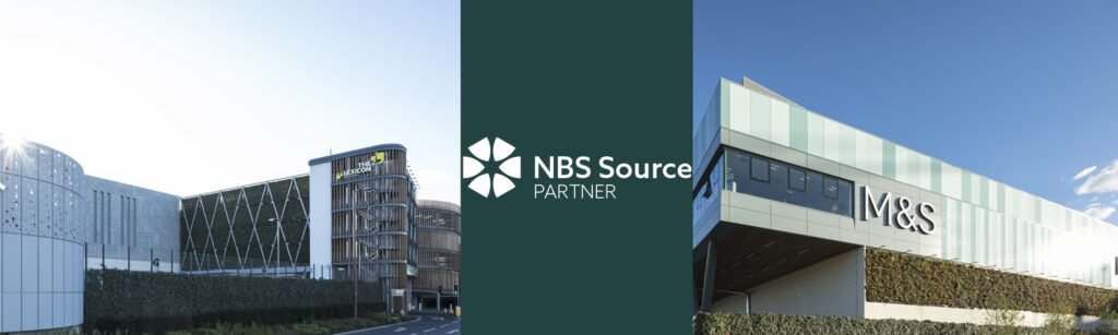 Banner with the NBS Source Partner logo between buildings with green facades, including an M&S building